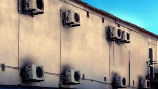 air-conditioning-modern-equipment-for-cooling-air-on-the-wall-of-a-concrete-house-street-outdoors