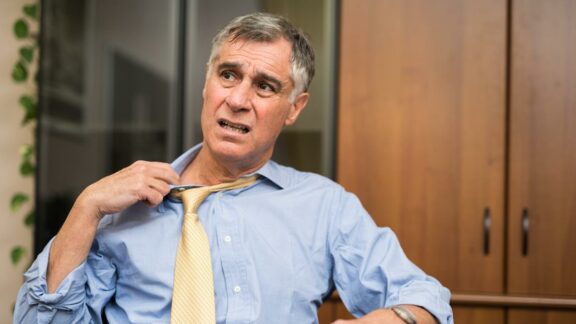 businessman-sweating-in-his-office