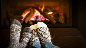 feet-warming-by-fireplace